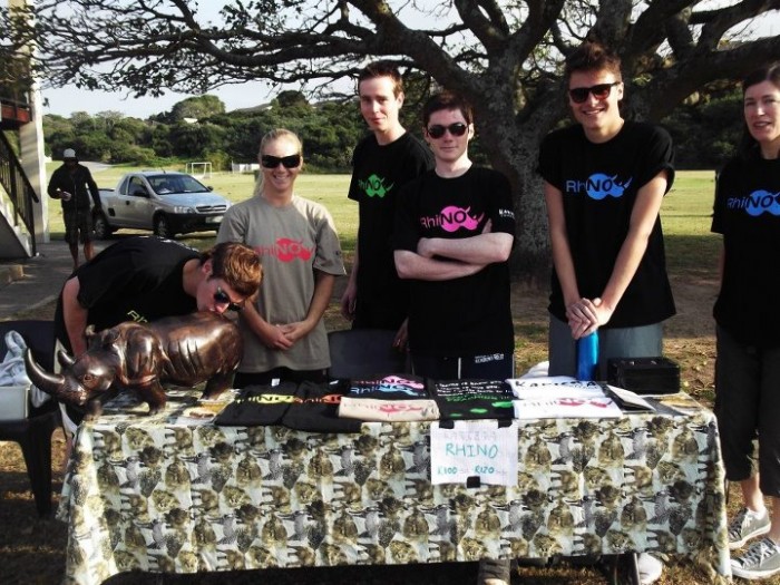 volunteers for the preservation of rhinos fundraising, by selling t shirts