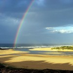 A rainbow on a beach in South Africa