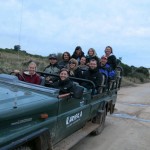 A group of Gap Africa volunteers travelling on a Kariega jeep