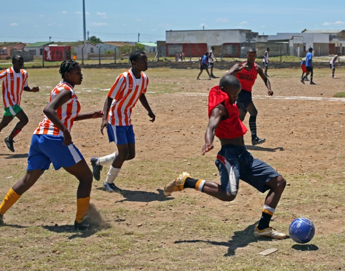 A group of local youths playing football
