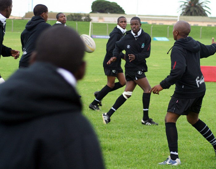 Teenage boys play rugby in South Africa
